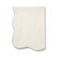 A flat-lay view of the La Mascot picot trim blanket in white and green.