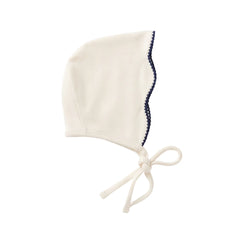 A flat-lay view of the La Mascot picot trim bonnet.