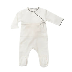 A flat-lay view of the La Mascot white and blue picot trim footie.