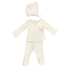 A front view of the elegant white Latte Rib Lace Knit set with matching bonnet.