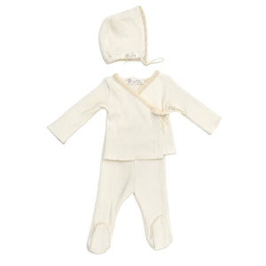 A front view of the elegant white Latte Rib Lace Knit set with matching bonnet.