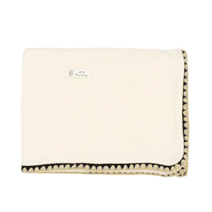 A front view of the elegant ivory Latte Carousel Stitching Blanket.