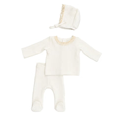 A front view of the elegant ivory Latte 2-pc. set with lace trim and matching bonnet.