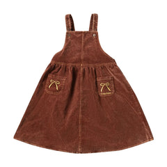 A front view of the limited edition brick embroidered bow children's pinafore jumper.