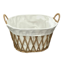 A sophisticated Lined Wicker Storage Basket with a crisp white cotton liner, showcasing its architectural weave and premium hand-crafted detail.