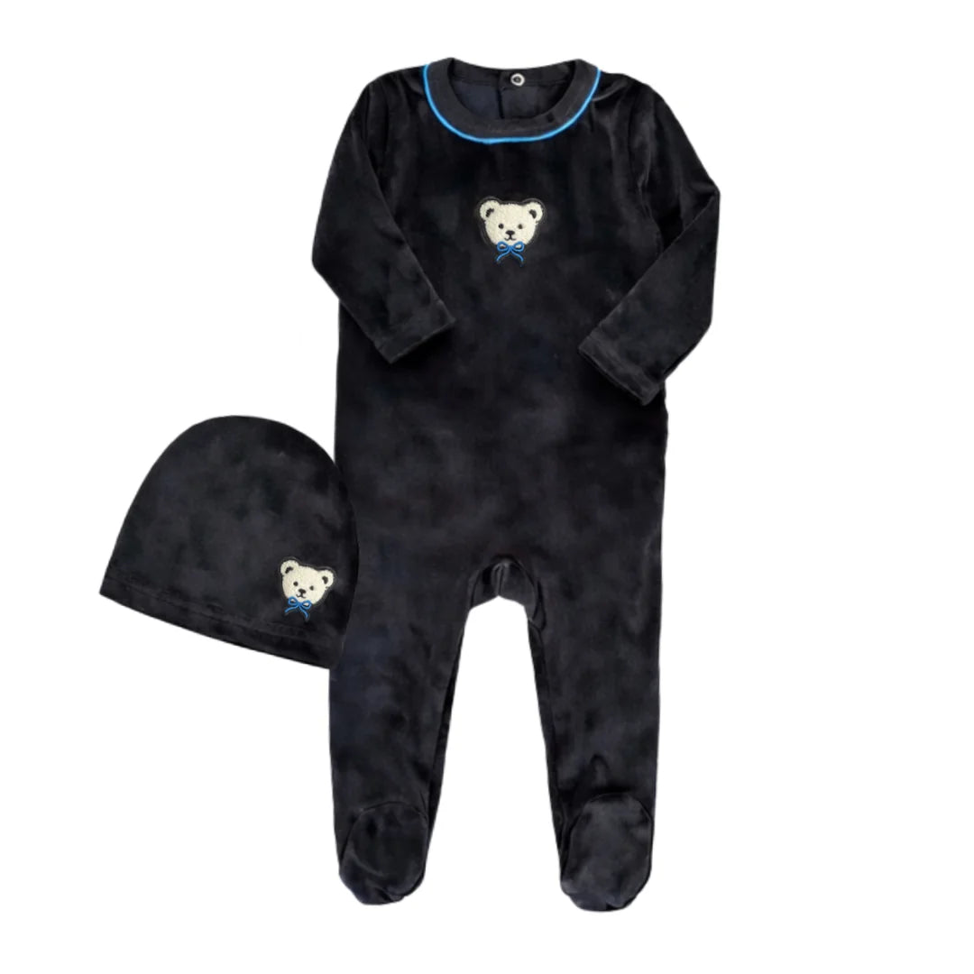 A front view of the Little Label black velour baby footie and matching hat with blue piping