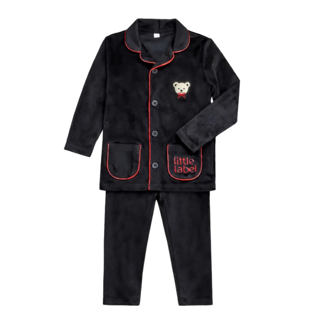 A front view of the Little Label black velour grandpa pajama with red piping.