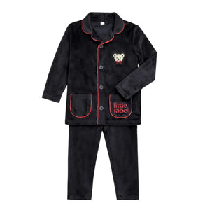 A front view of the Little Label black velour grandpa pajama with red piping.