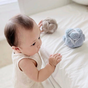 The baby blue MONTI toy placed in a serene, modern nursery setting, highlighting its aesthetic appeal.