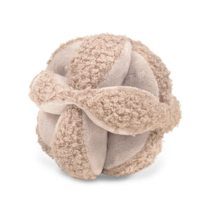 The Little Lamb Kind MONTI developmental toy in a soft oat color.