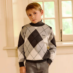 child styled in the Little Parni boys' argyle sweater