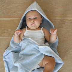 A front view of the blue Little Threads hooded bath towel with a classic lattice pattern.