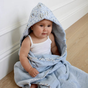 A front view of the blue Little Threads hooded bath towel featuring a rocking horse motif on the hood.