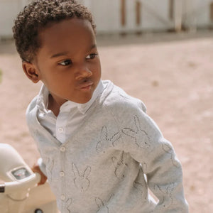 A little one wearing the grey Livly bunny cardigan for a classic, sophisticated boutique look.