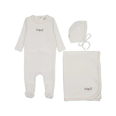 A front view of the Mema Knits white floral embroidery three-piece set.