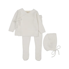 A front view of the Mema Knits knitted bris set in winter white.
