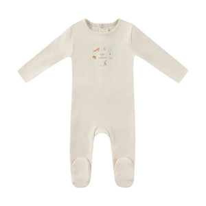 A front view of the Mini Label ivory baby boy footie with a Little Explorer graphic.