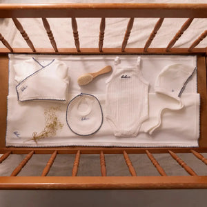 A high-resolution close-up highlighting the soft white velour fabric texture and finishing.