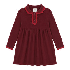 A front view of the Mini P red tonal knit baby dress.