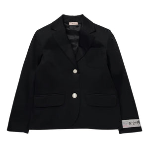 A front view of the structured N°21 Kids black blazer with an embroidered logo patch.
