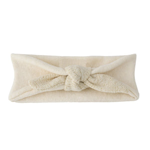 A breathtaking 1+ in the Family Ajaccio Knit Head Wrap in Ecru, showcasing its authoritative architectural knot and refined Spanish knit texture.