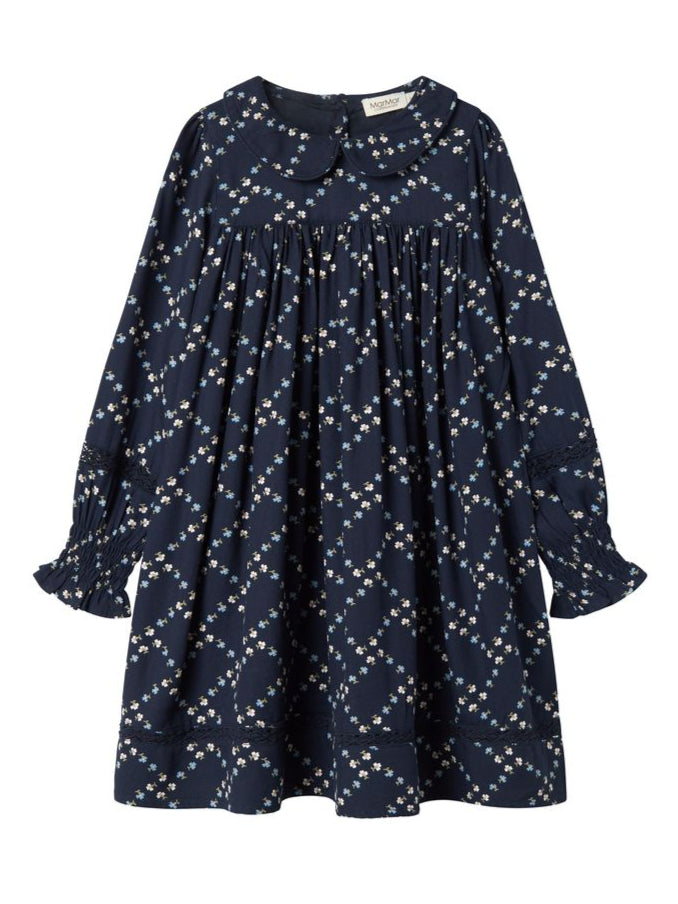 Navy dress with white floral pattern on a white background