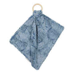 A sophisticated Peluche Bebe Mini Lux Fur Teether in Bluewash Heather, featuring a soft textured blue plush fabric looped through a smooth, architectural wooden ring.