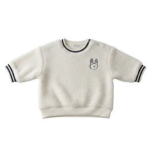 A breathtaking Petit Bateau hooded sherpa jacket featuring an immaculate cream palette and a cozy plush silhouette.