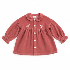 Red corduroy dress with floral embroidery on a white background