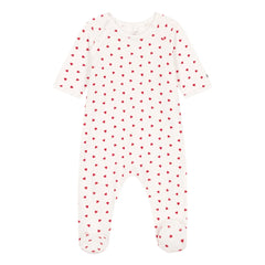 White baby onesie with red heart pattern on a white background