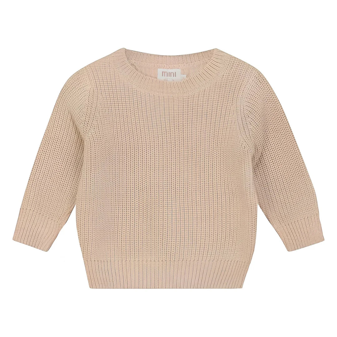 A breathtaking Pompomme Kids Beige Chunky Sweater, showcasing its authoritative architectural knit and refined neutral texture for a curated wardrobe.