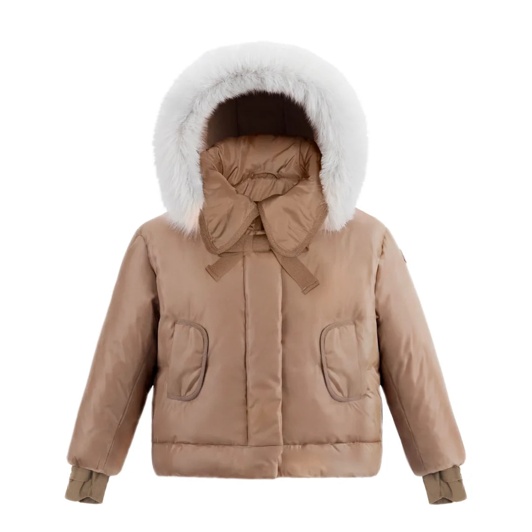 A front view of the Pramie camel jacket with a tied bow for girls.