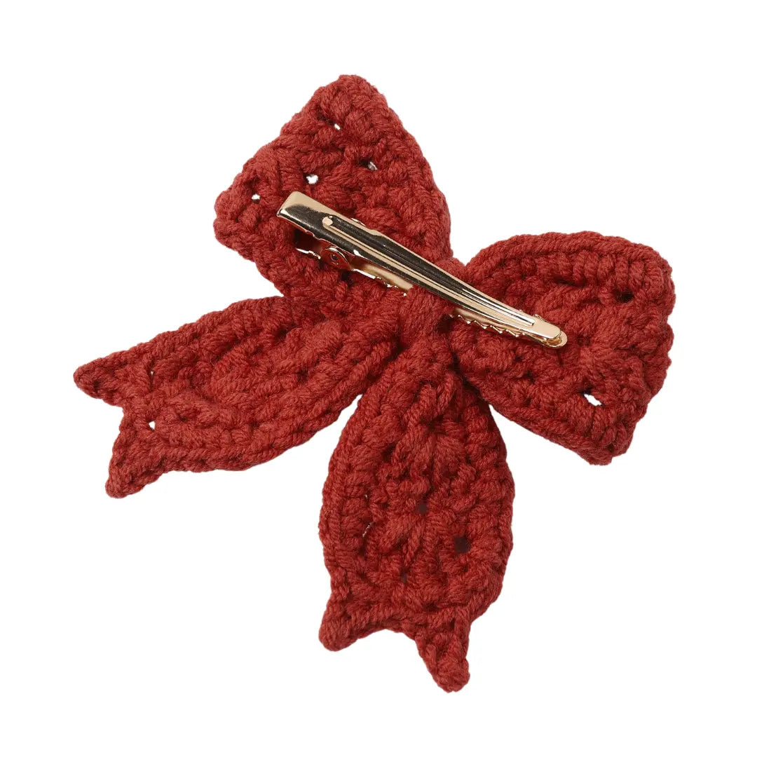 A high-resolution close-up of the organic cotton crochet knit texture.