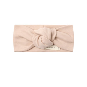 A front view of the Quincy Mae dusty rose organic cotton knotted baby headband.