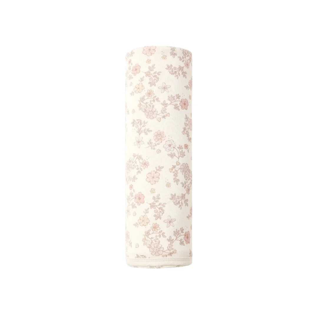 A flat lay view of the Quincy Mae vine floral organic cotton baby swaddle blanket.