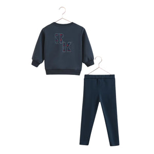 A beautifully structured RetroKid Arden two-piece baby boy set in a versatile indigo blue scuba fabric back side