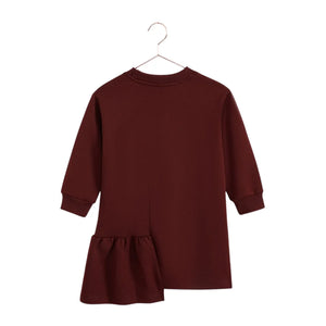 A beautifully styled RetroKid Arden dress in cranberry red featuring delicate side ruffles for babies and toddlers back