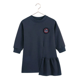 The front of the indigo blue Arden ruffle dress for girls by RetroKid, displaying its clean and simple rear profile.