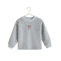 RetroKid featuring sporty red accents and a structured scuba fabric.