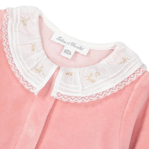 A high-resolution close-up of the ultra-soft cotton fabric texture and velvet collar trim.
