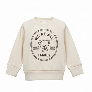 Beige sweatshirt with a black graphic and text on a white background