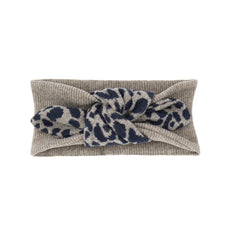 A soft blue 1+ in the Family Parma bandeau hair accessory for babies.