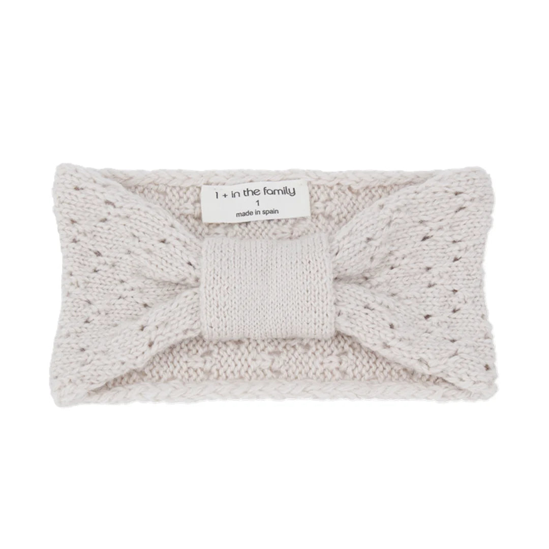 A front view of the 1+ in the Family SAVONA infant bandeau in rice color.
