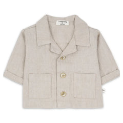 A sophisticated 1+ in the Family Jacket in a muted beige tone, showcasing its structured silhouette and high-end boutique finish.