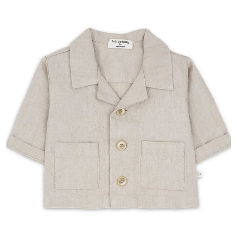 A sophisticated 1+ in the Family Jacket in a muted beige tone, showcasing its structured silhouette and high-end boutique finish.