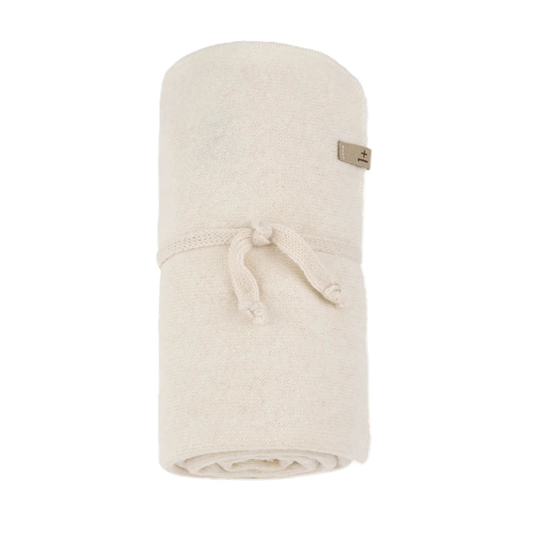 A softly folded 1+ in the Family BOBIGNY baby blanket showcasing its modern texture in a natural ecru color.
