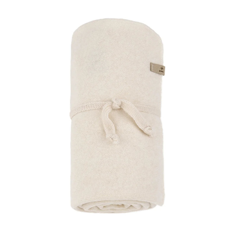 A softly folded 1+ in the Family BOBIGNY baby blanket showcasing its modern texture in a natural ecru color.