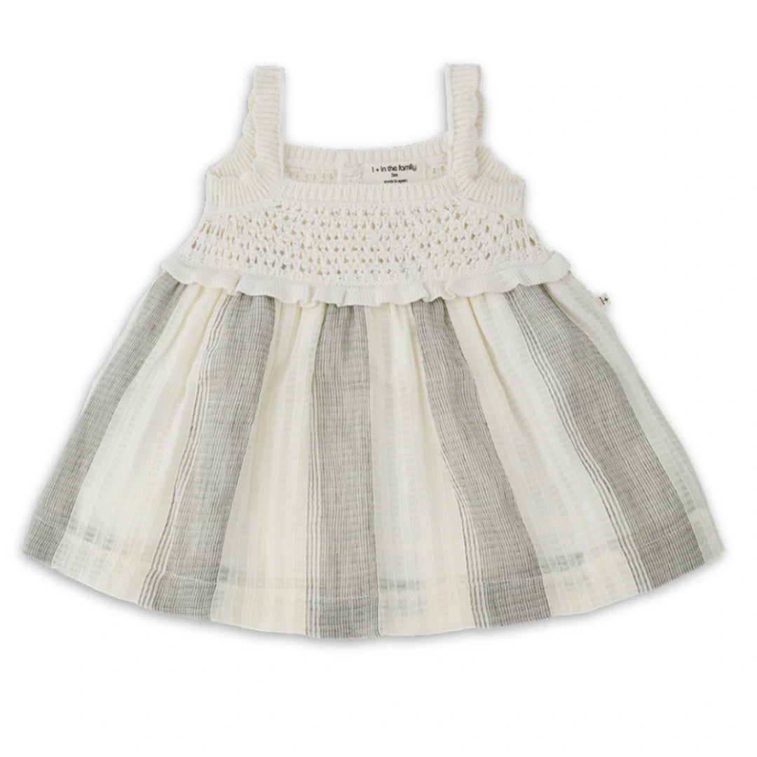 A minimalist 1+ in the Family Fontclara dress featuring a modern A-line silhouette and luxe textured fabric in a neutral earth tone