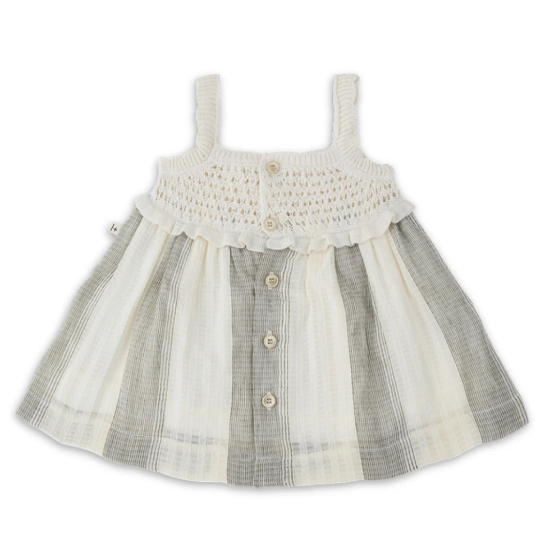 A minimalist 1+ in the Family Fontclara dress featuring a modern A-line silhouette and luxe textured fabric in a neutral earth tone