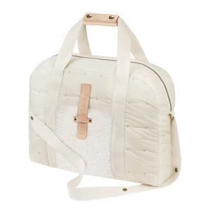 A sleek, neutral ecru 1+ in the Family maternity diaper bag styled for everyday use.
